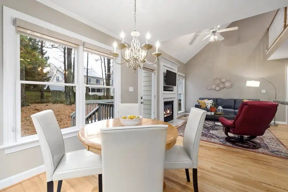 Finished open dining area with a fireplace